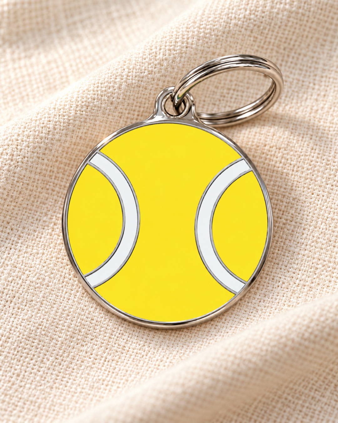 TAGiDOG Ace Shot Tennis ID Tag dog ID tag on light linen