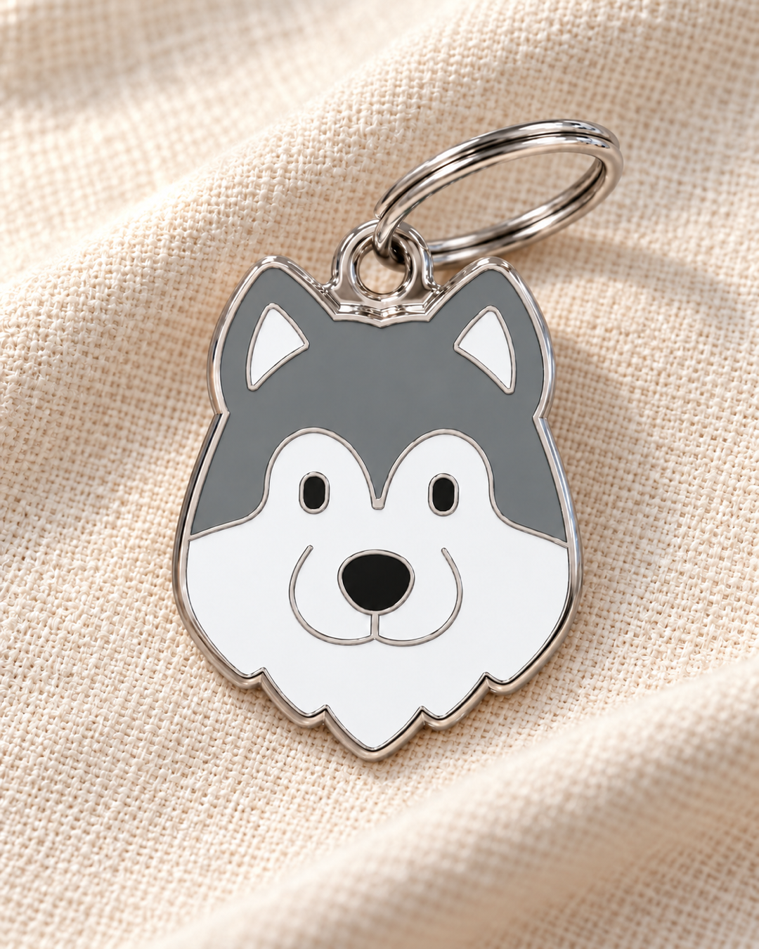 TAGiDOG Alaskan Malamute Dog ID Tag on light linen