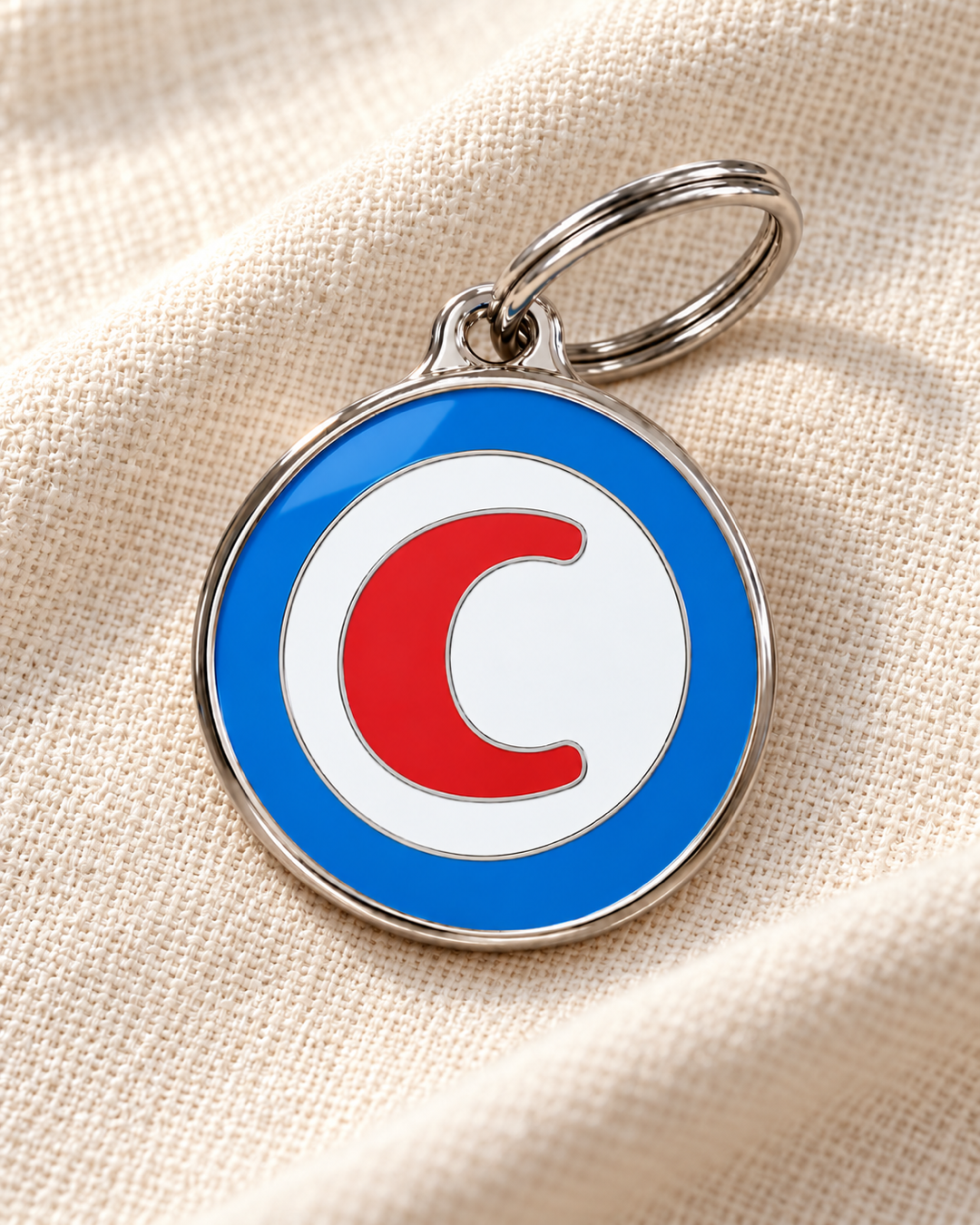 TAGiDOG letter C dog ID tag on light linen