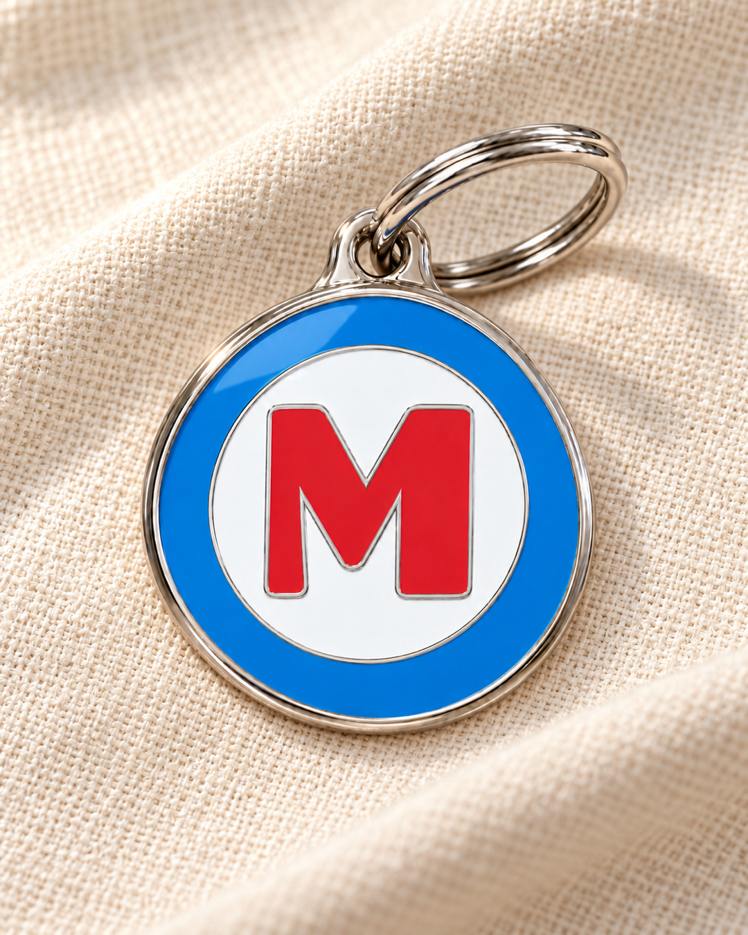 TAGiDOG letter M dog ID tag on light linen