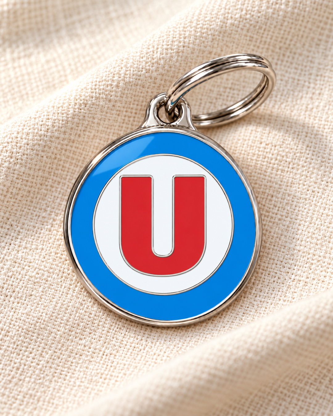 TAGiDOG letter U dog ID tag on light linen