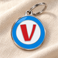 TAGiDOG letter V dog ID tag on light linen