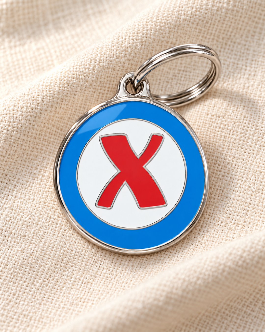 TAGiDOG letter X dog ID tag on light linen