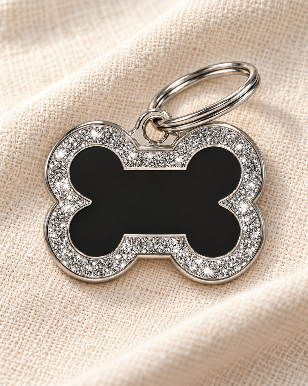 TAGiDOG Bone Spark Black ID Tag dog ID tag on light linen