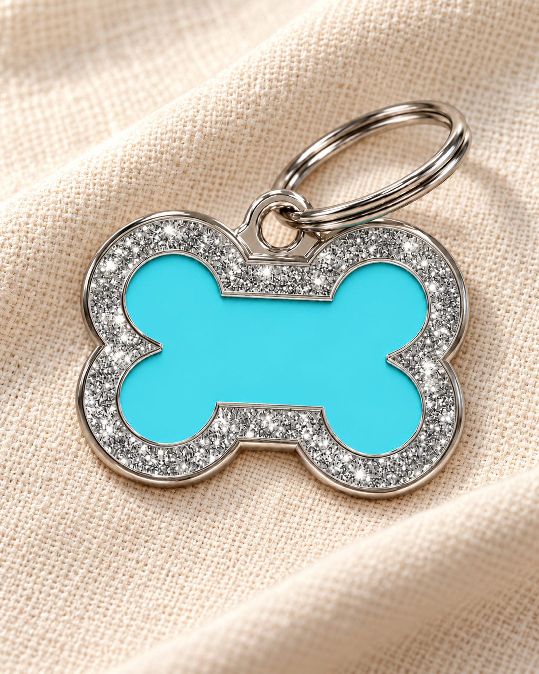TAGiDOG Bone Spark Blue ID Tag on light linen