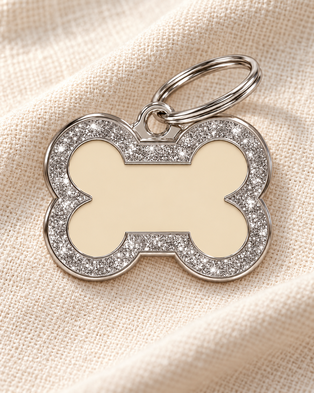 TAGiDOG Bone Spark Cream ID Tag dog ID tag on light linen