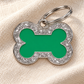 TAGiDOG Bone Spark Green ID Tag on light linen