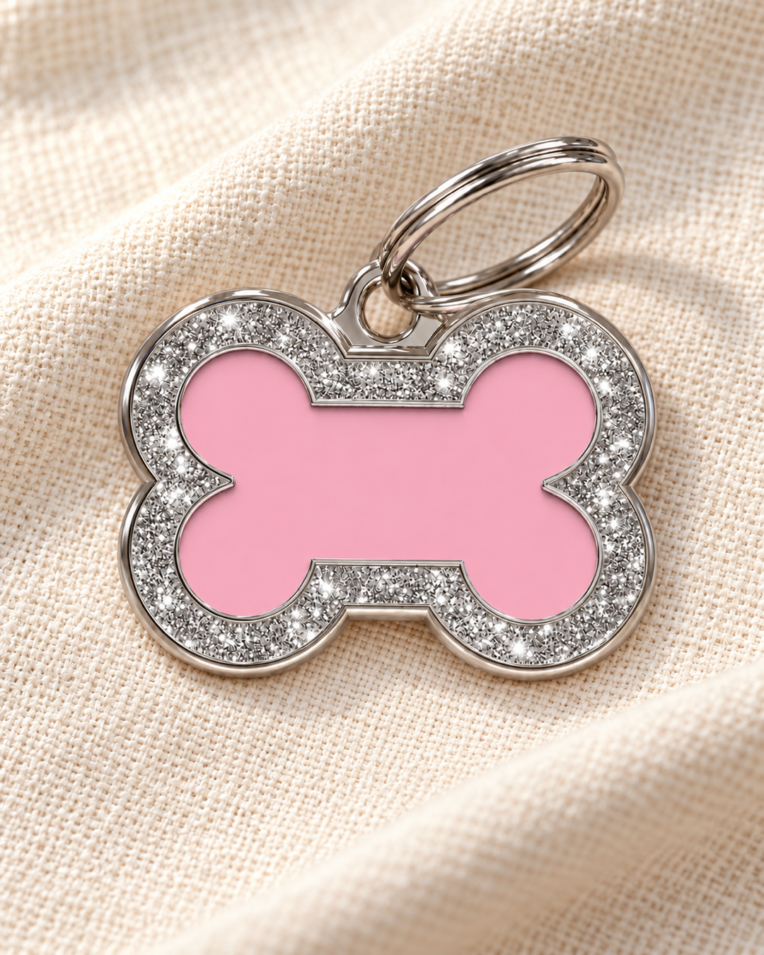 TAGiDOG Bone Spark Pink ID Tag on light linen