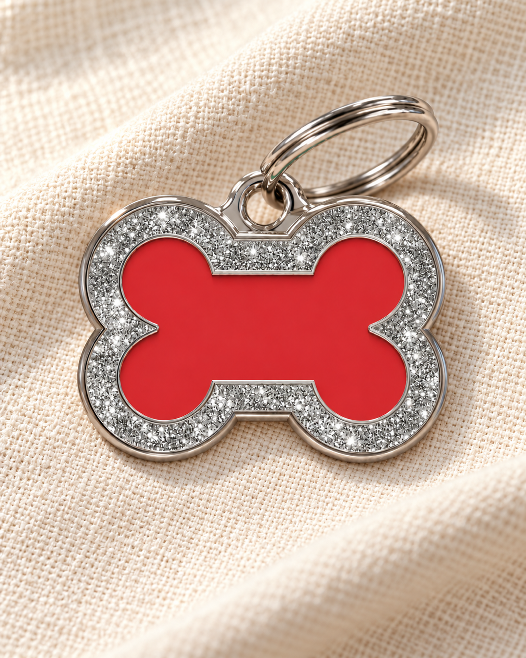 TAGiDOG Bone Spark Red ID Tag dog ID tag on light linen