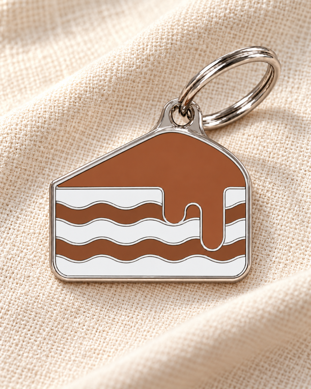 TAGiDOG Chocolate Cake ID Tag dog ID tag on light linen