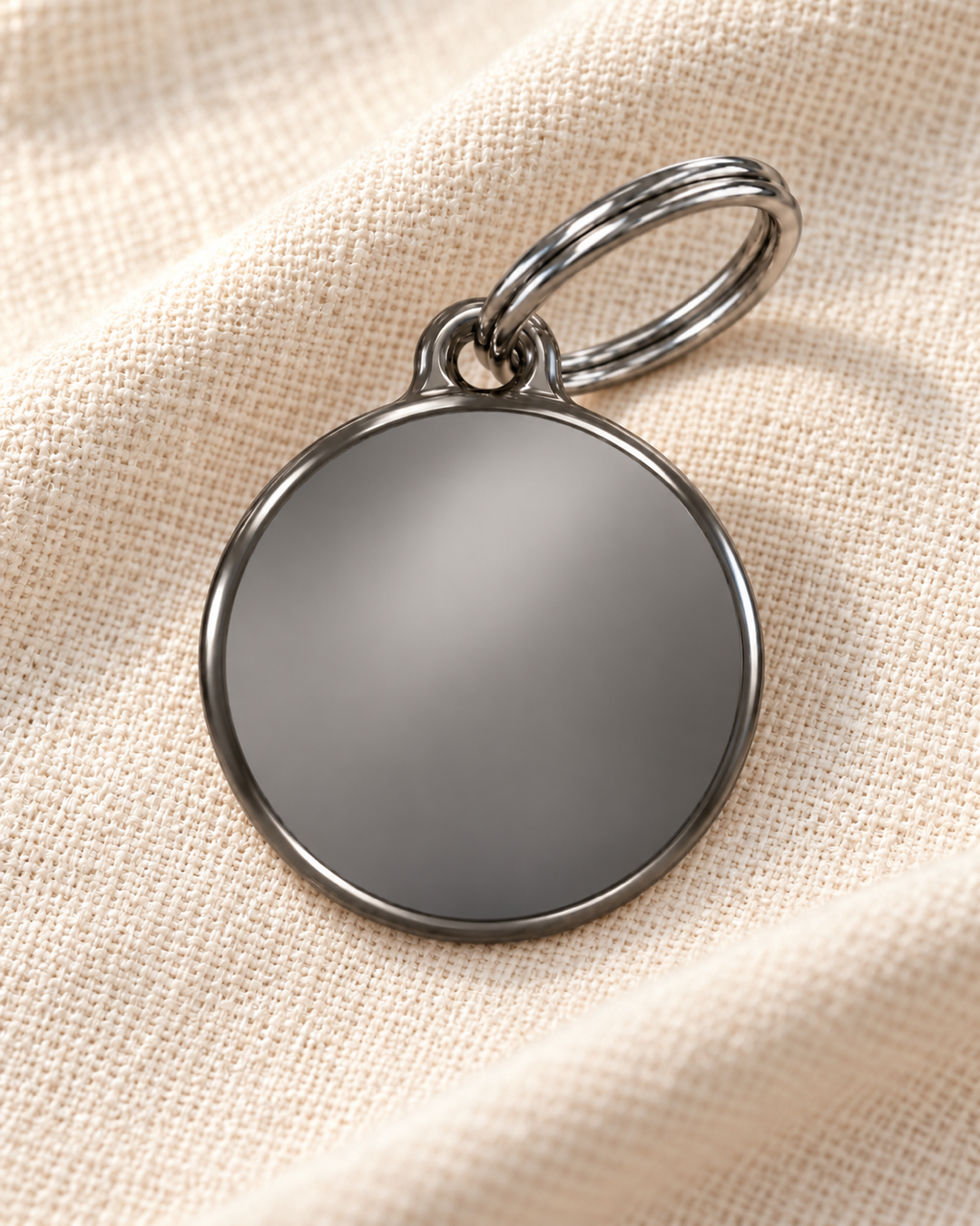 TAGiDOG Classic Fume Round ID Tag on light linen