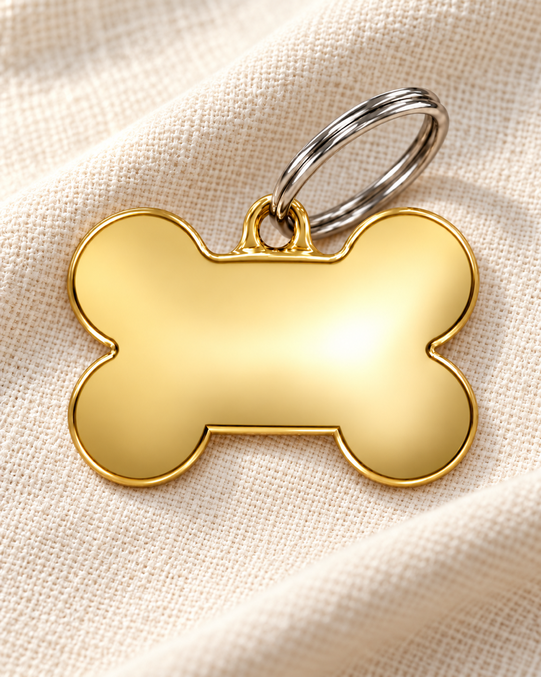 TAGiDOG Classic Gold Bone ID Tag Medium on light linen