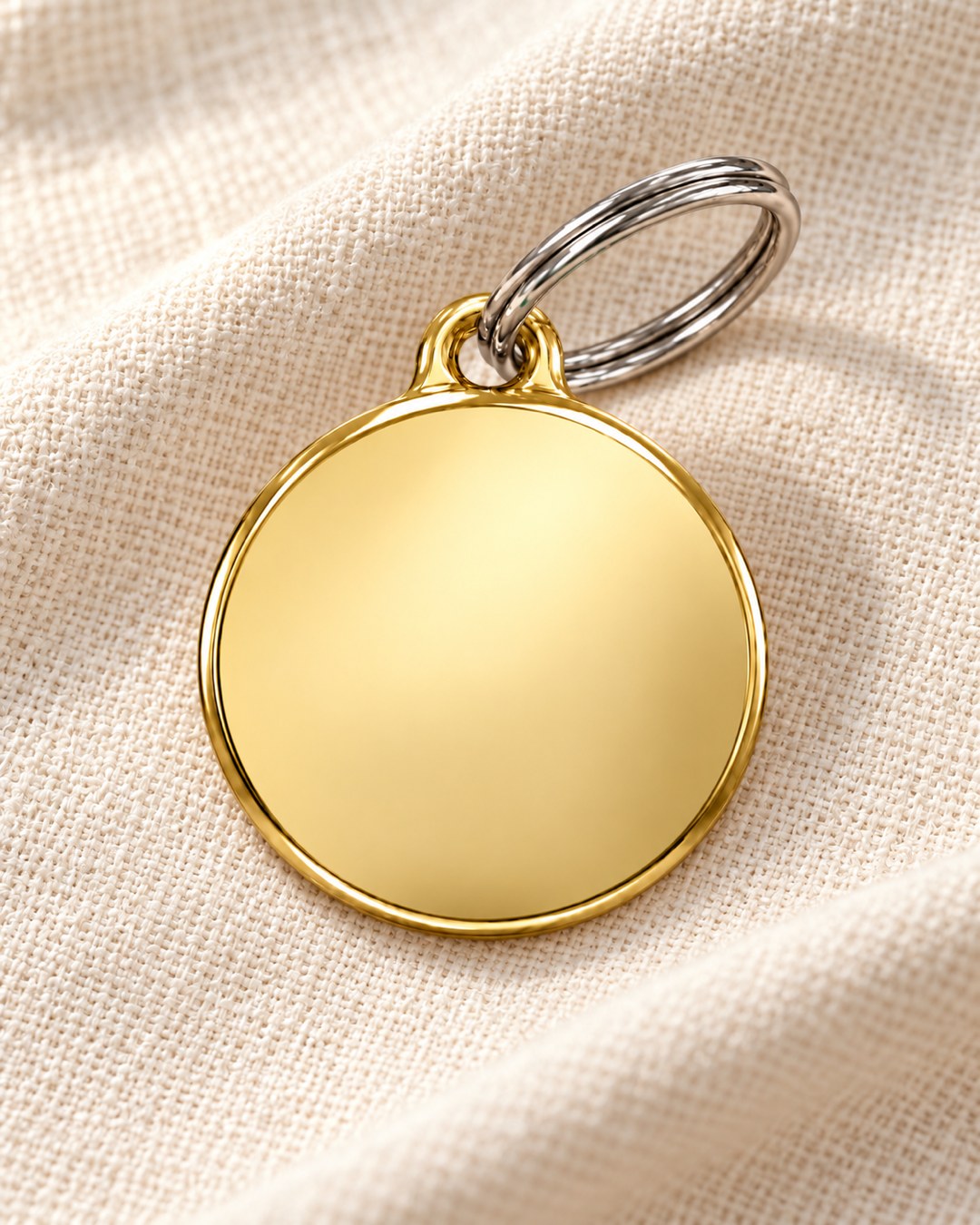 TAGiDOG Classic Gold Round ID Tag on light linen