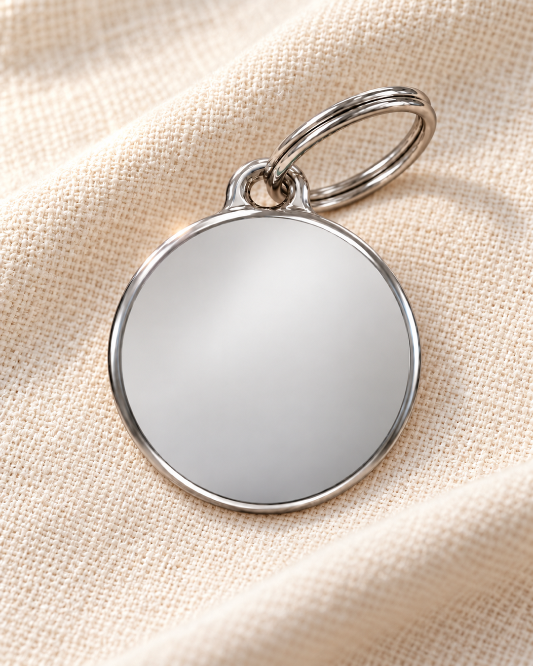TAGiDOG Classic Round ID Tag dog ID tag on light linen
