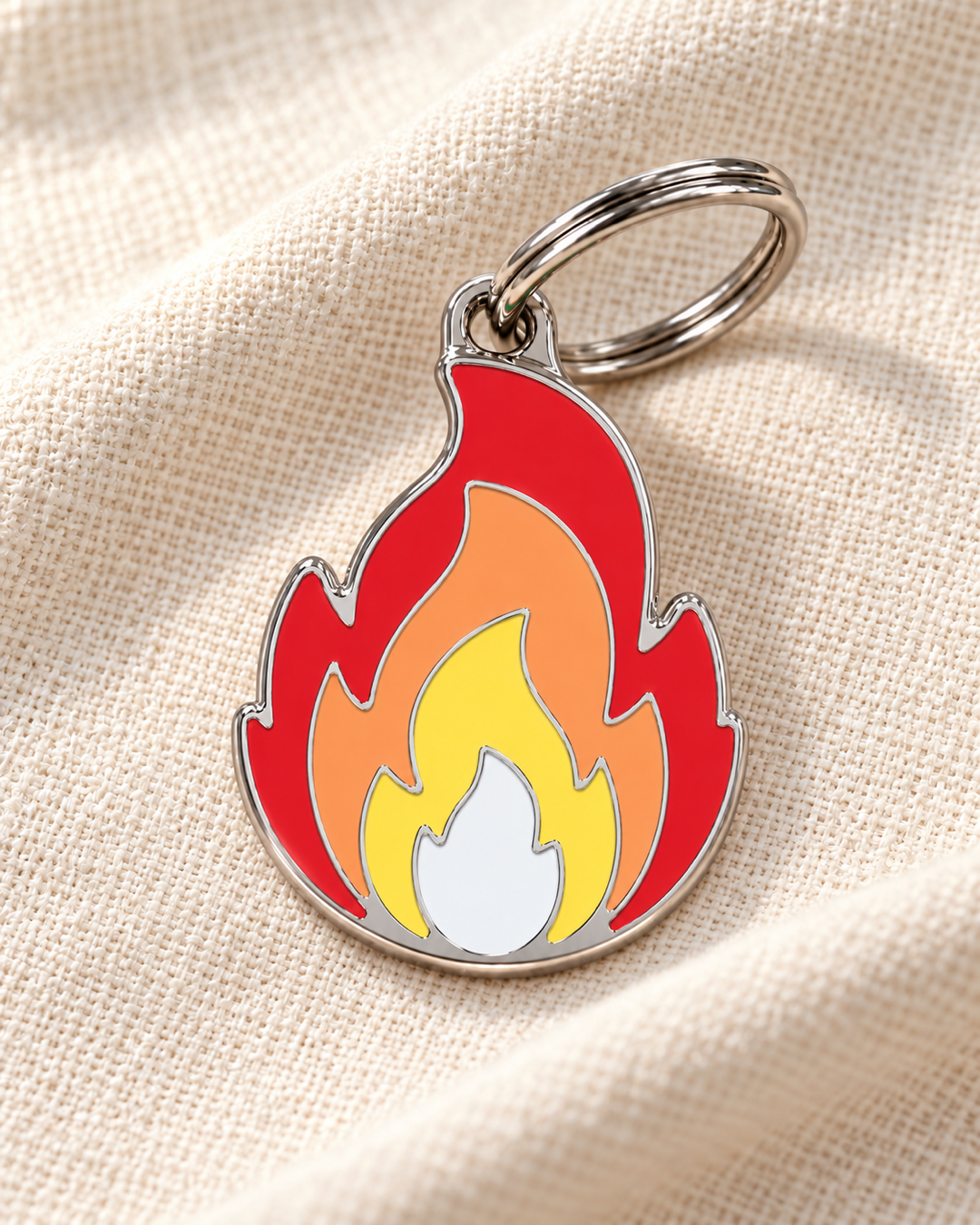 TAGiDOG Emoji Blaze dog ID tag on light linen
