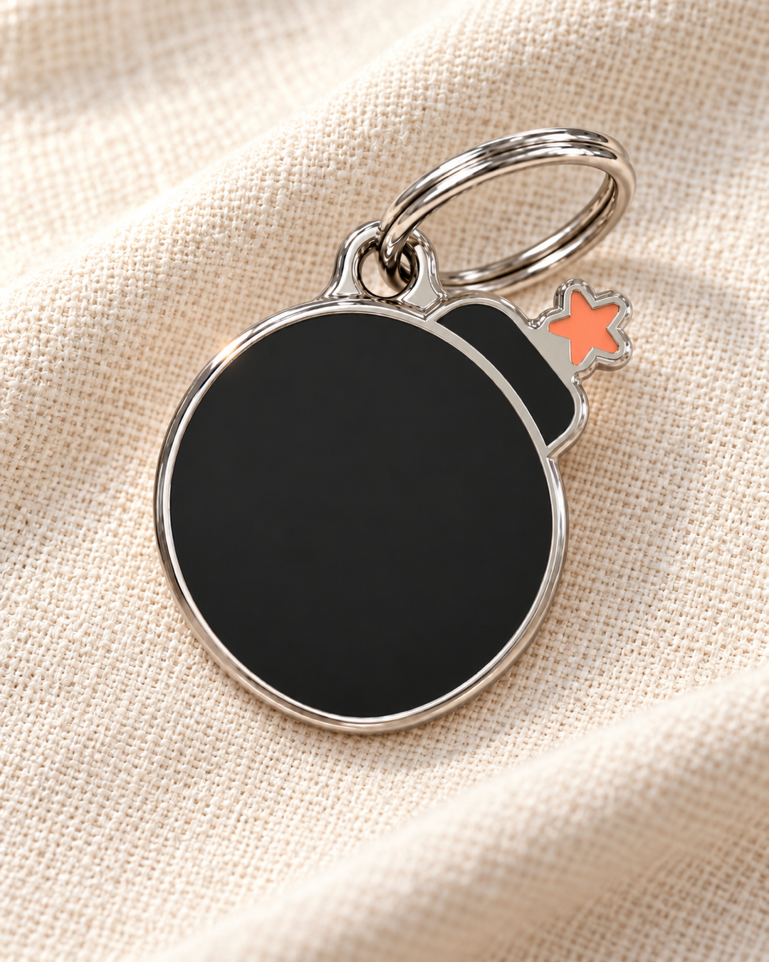 TAGiDOG Emoji Boom dog ID tag on light linen