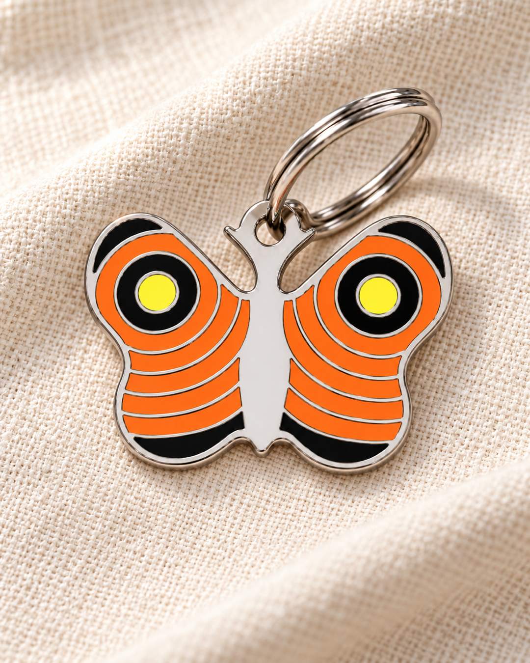 TAGiDOG Emoji Butterfly dog ID tag on light linen