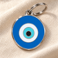 TAGiDOG Emoji Evil Eye dog ID tag on light linen