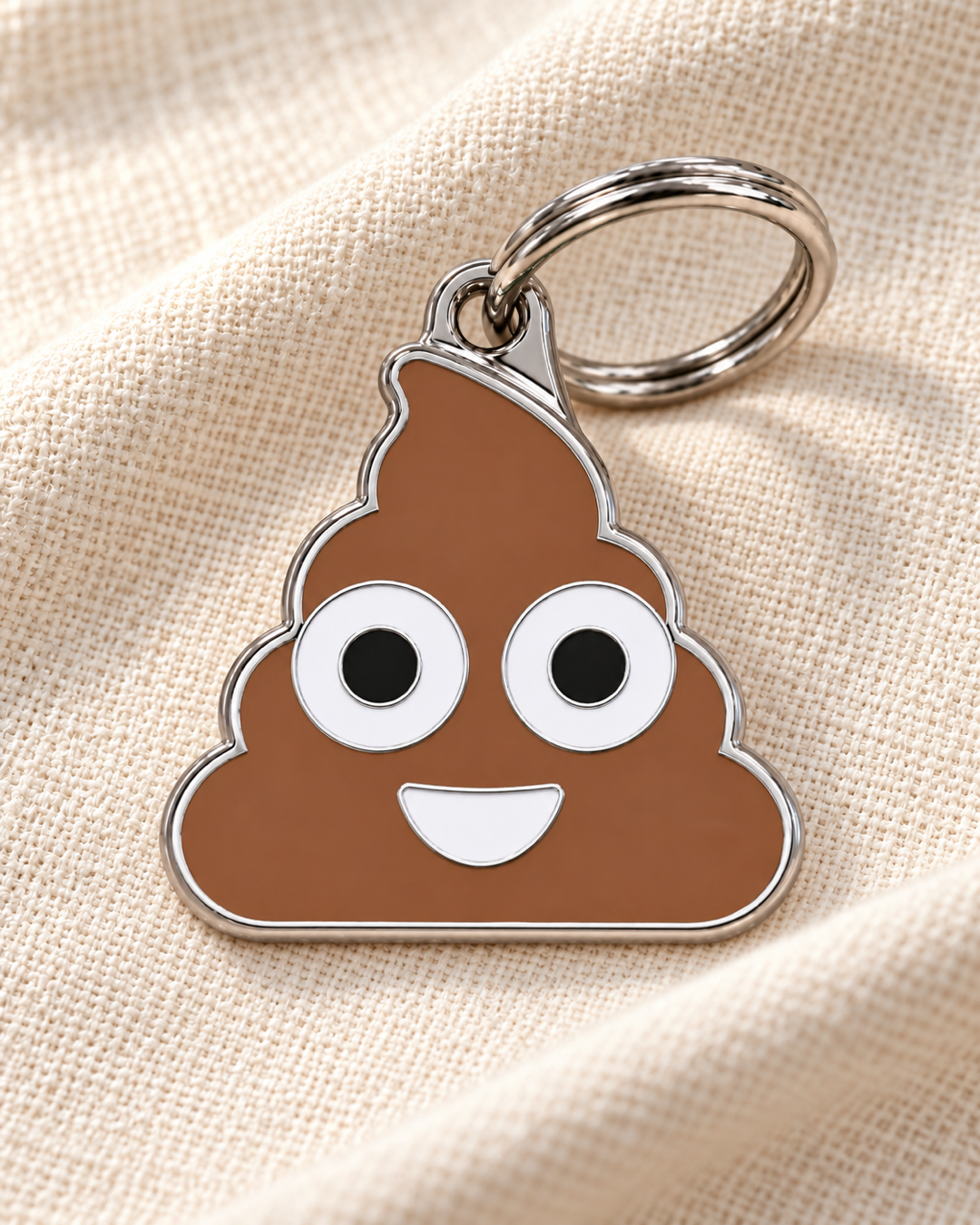 TAGiDOG Emoji Poopie dog ID tag on light linen