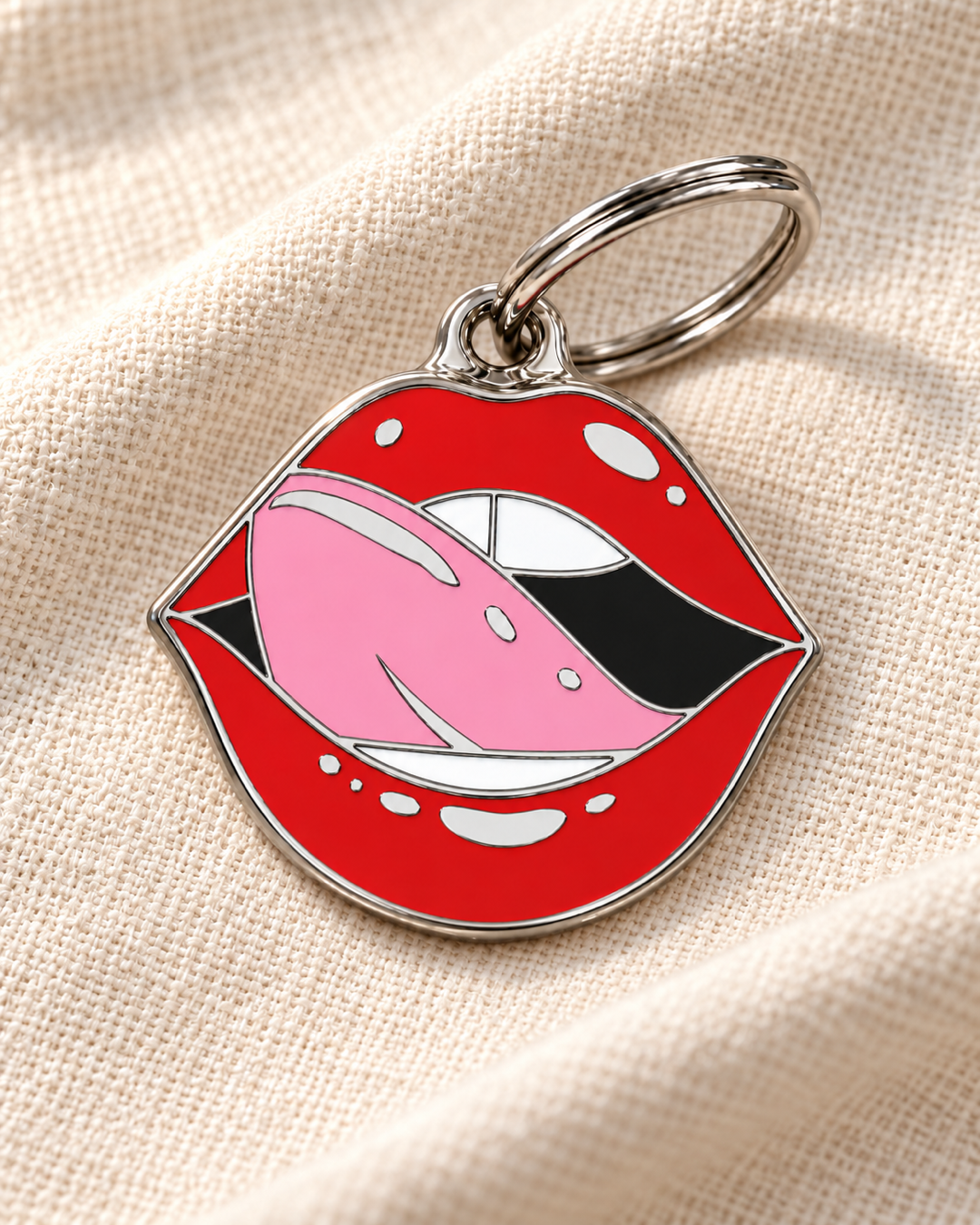 TAGiDOG Emoji Smooch dog ID tag on light linen