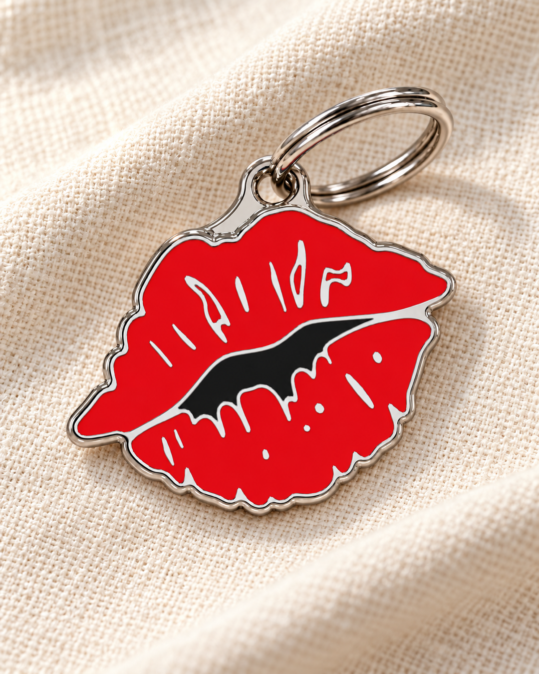 TAGiDOG Emoji Wild Kiss dog ID tag on light linen