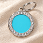 TAGiDOG Glorious Blue Round ID Tag on light linen