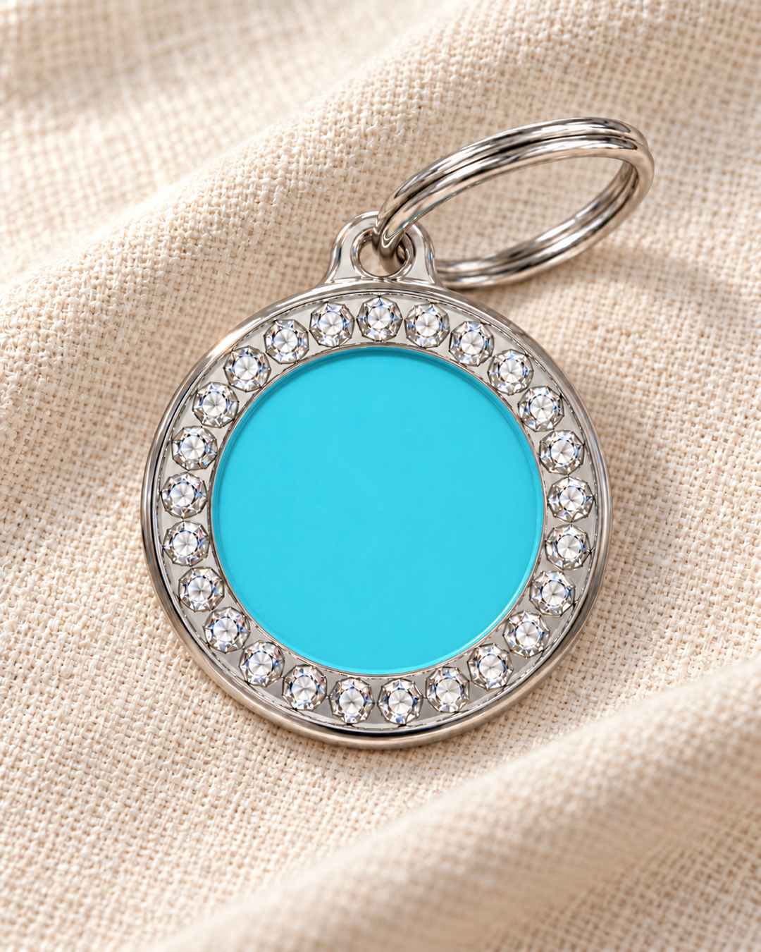 TAGiDOG Glorious Blue Round ID Tag on light linen