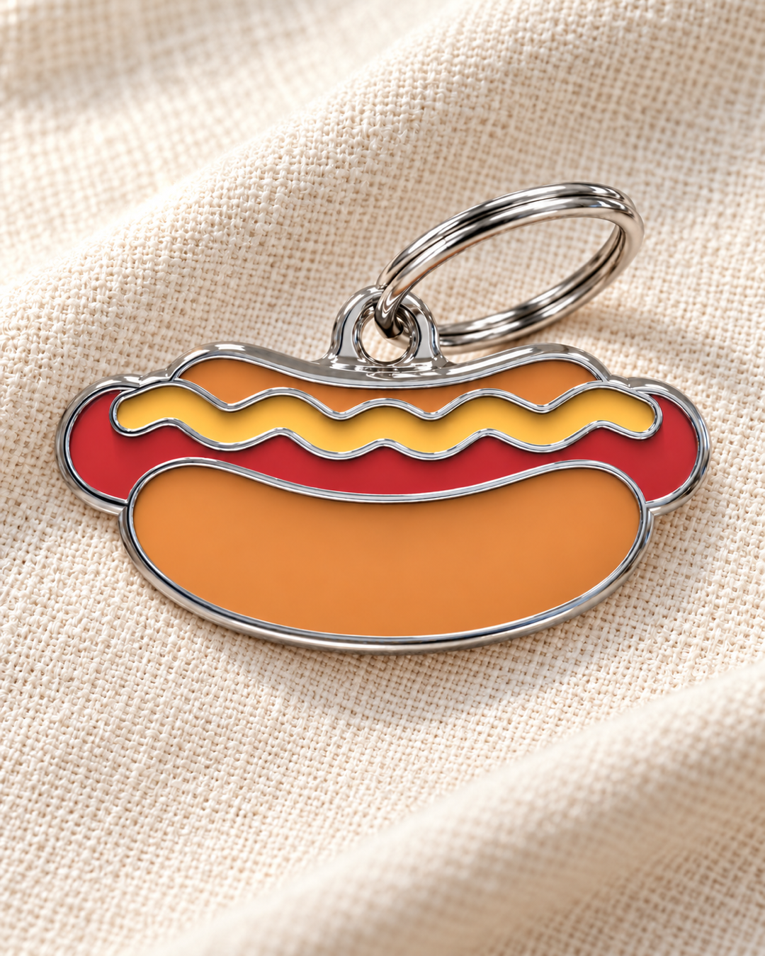 TAGiDOG Hot Dog ID Tag dog ID tag on light linen