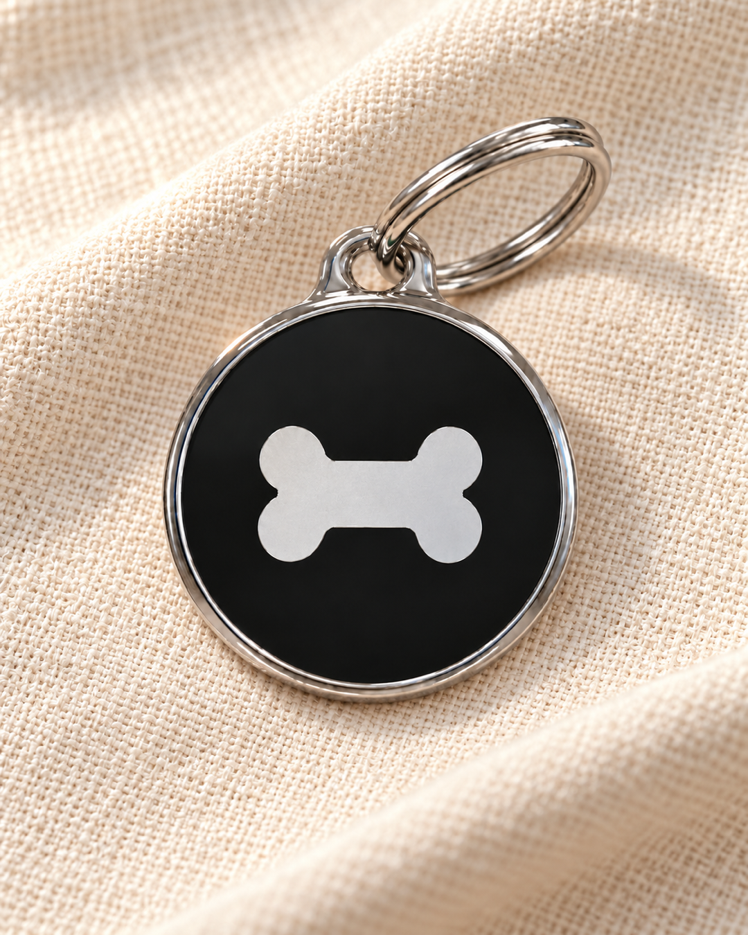 TAGiDOG Icon Bone Black ID Tag Small on light linen