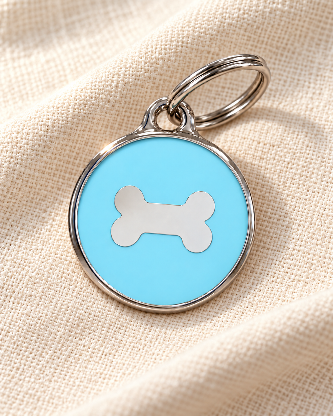 TAGiDOG Icon Bone Ice ID Tag dog ID tag on light linen