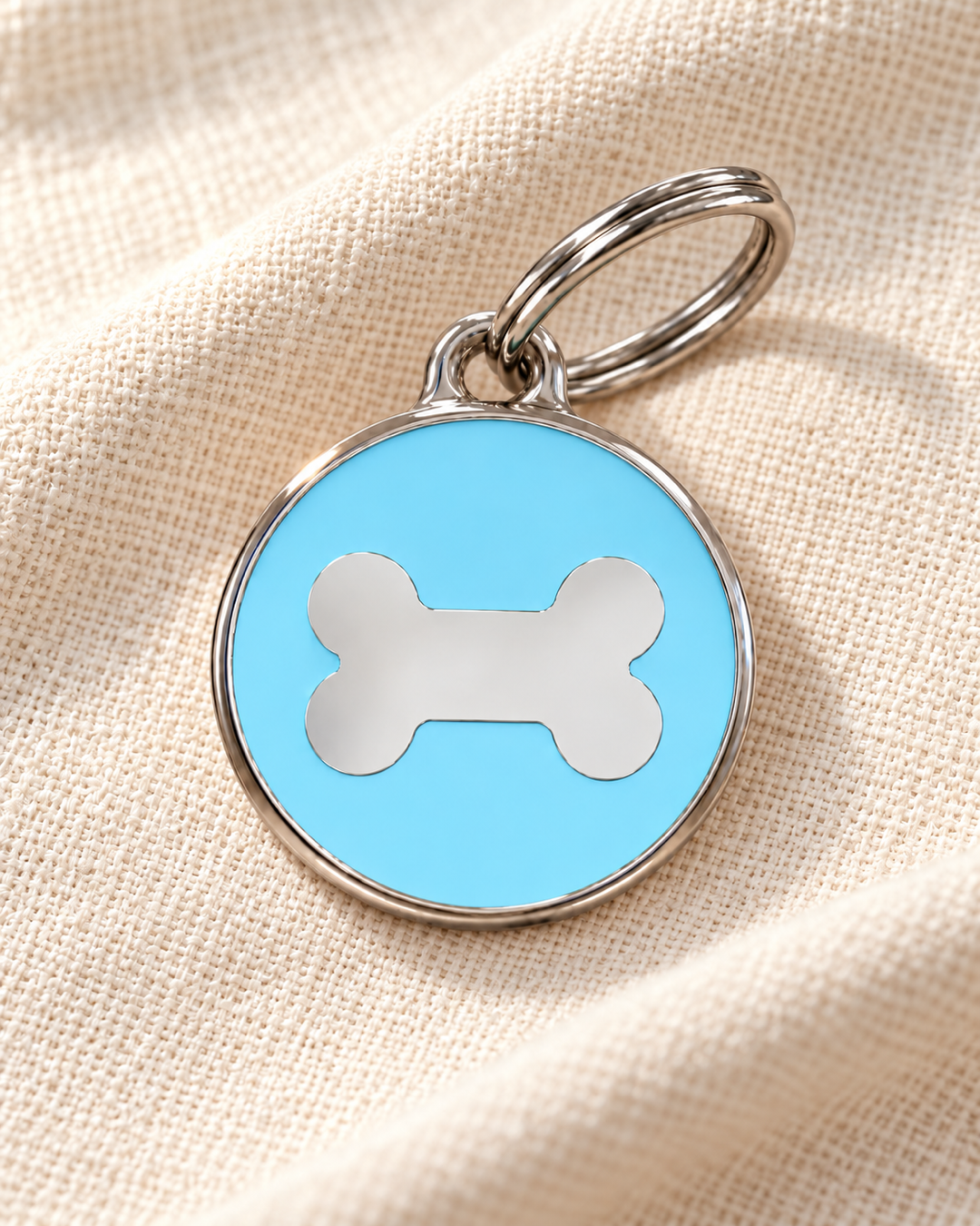 TAGiDOG Icon Bone Ice ID Tag Medium dog ID tag on light linen
