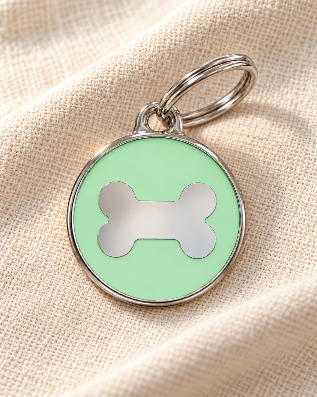 TAGiDOG Icon Bone Pistachio ID Tag Medium dog ID tag on light linen