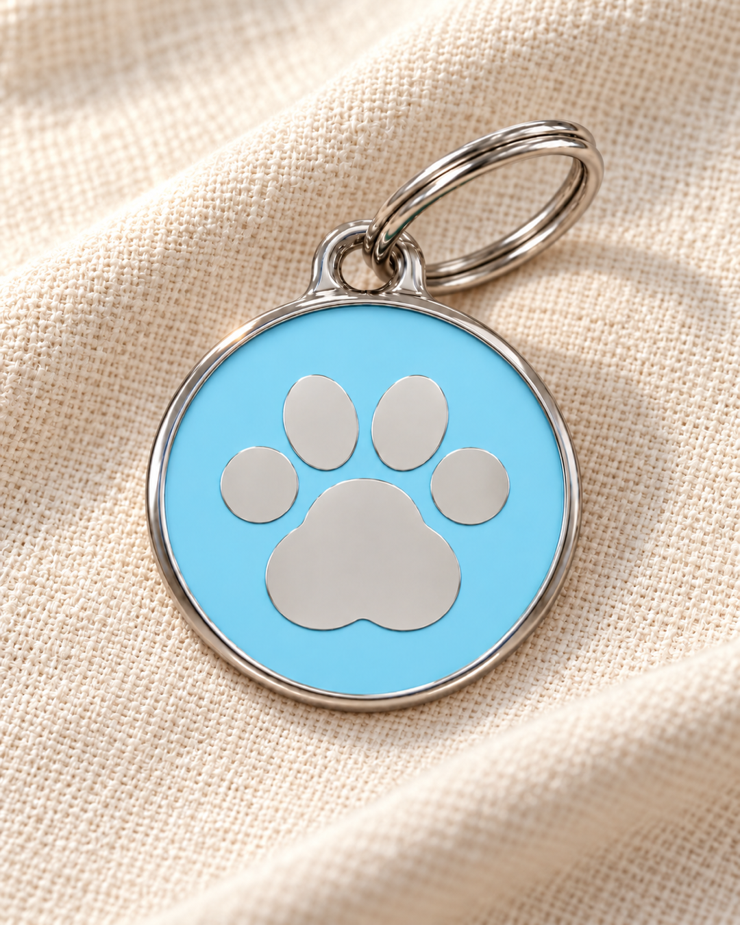 TAGiDOG Icon Paw Ice ID Tag dog ID tag on light linen
