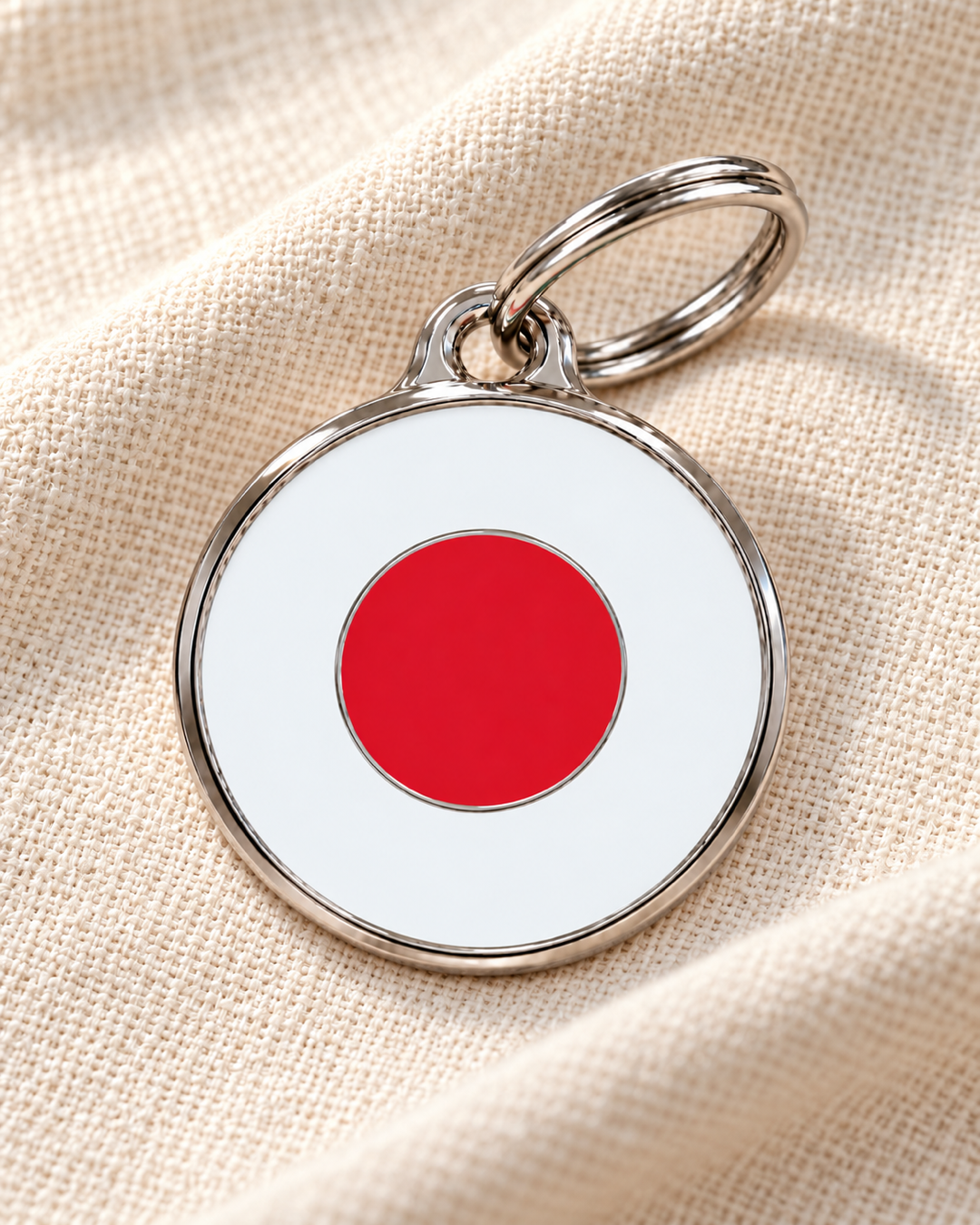 TAGiDOG Japan flag dog ID tag on light linen fabric