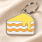 TAGiDOG Lemon Cake ID Tag dog ID tag on light linen