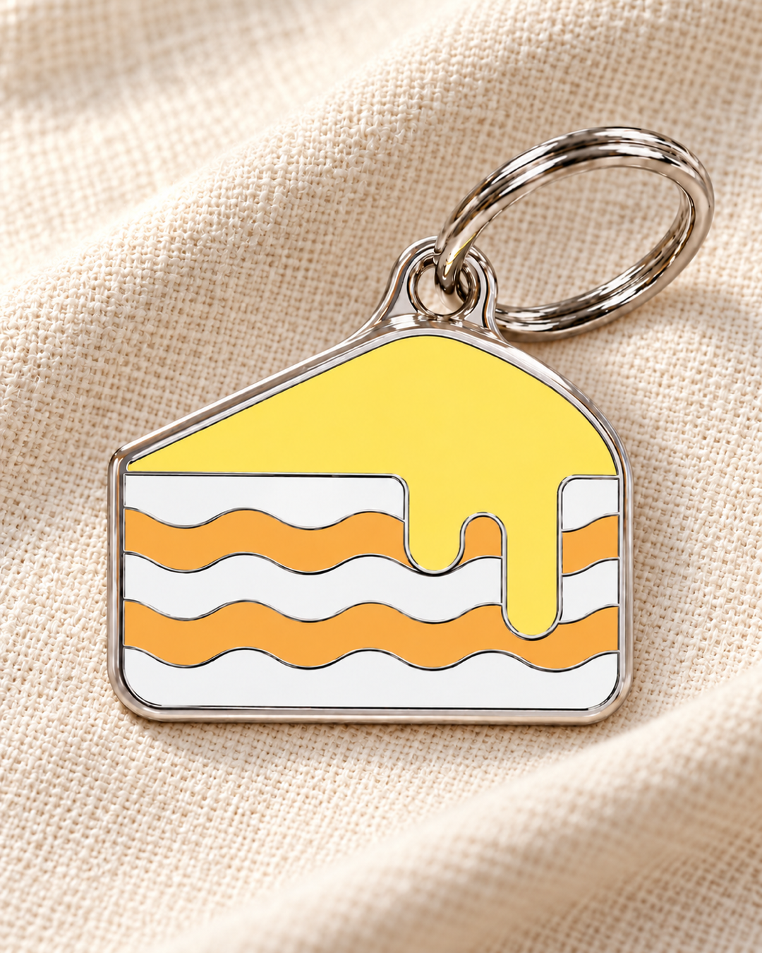 TAGiDOG Lemon Cake ID Tag dog ID tag on light linen