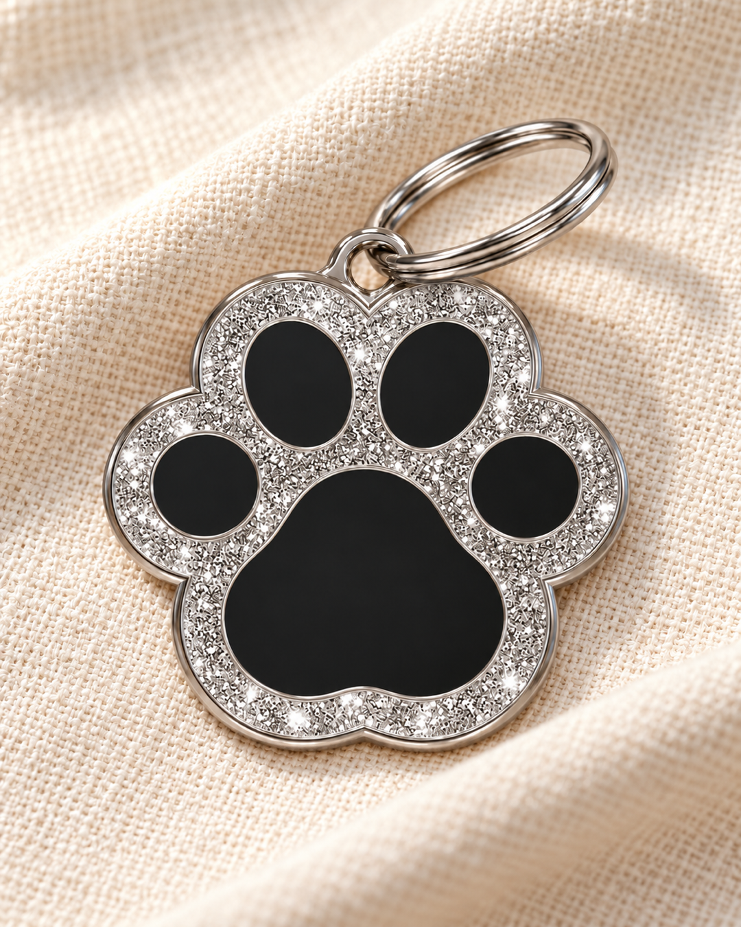 TAGiDOG Paw Spark Black ID Tag dog ID tag on light linen