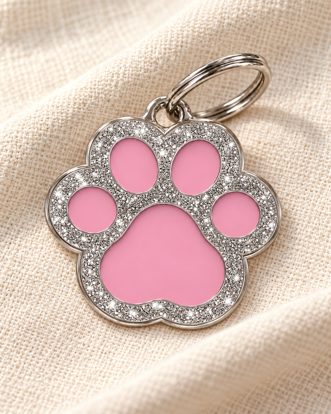 TAGiDOG Paw Spark Pink ID Tag on light linen