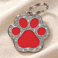 TAGiDOG Paw Spark Red ID Tag dog ID tag on light linen