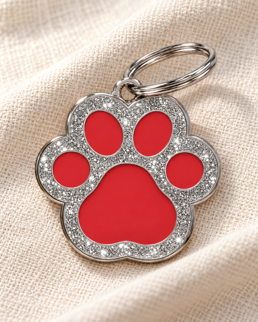 TAGiDOG Paw Spark Red ID Tag dog ID tag on light linen