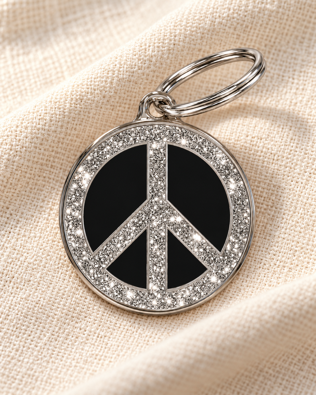 TAGiDOG Peace Spark Black ID Tag dog ID tag on light linen