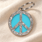 TAGiDOG Peace Spark Blue ID Tag on light linen
