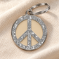 TAGiDOG Peace Spark Cream ID Tag dog ID tag on light linen