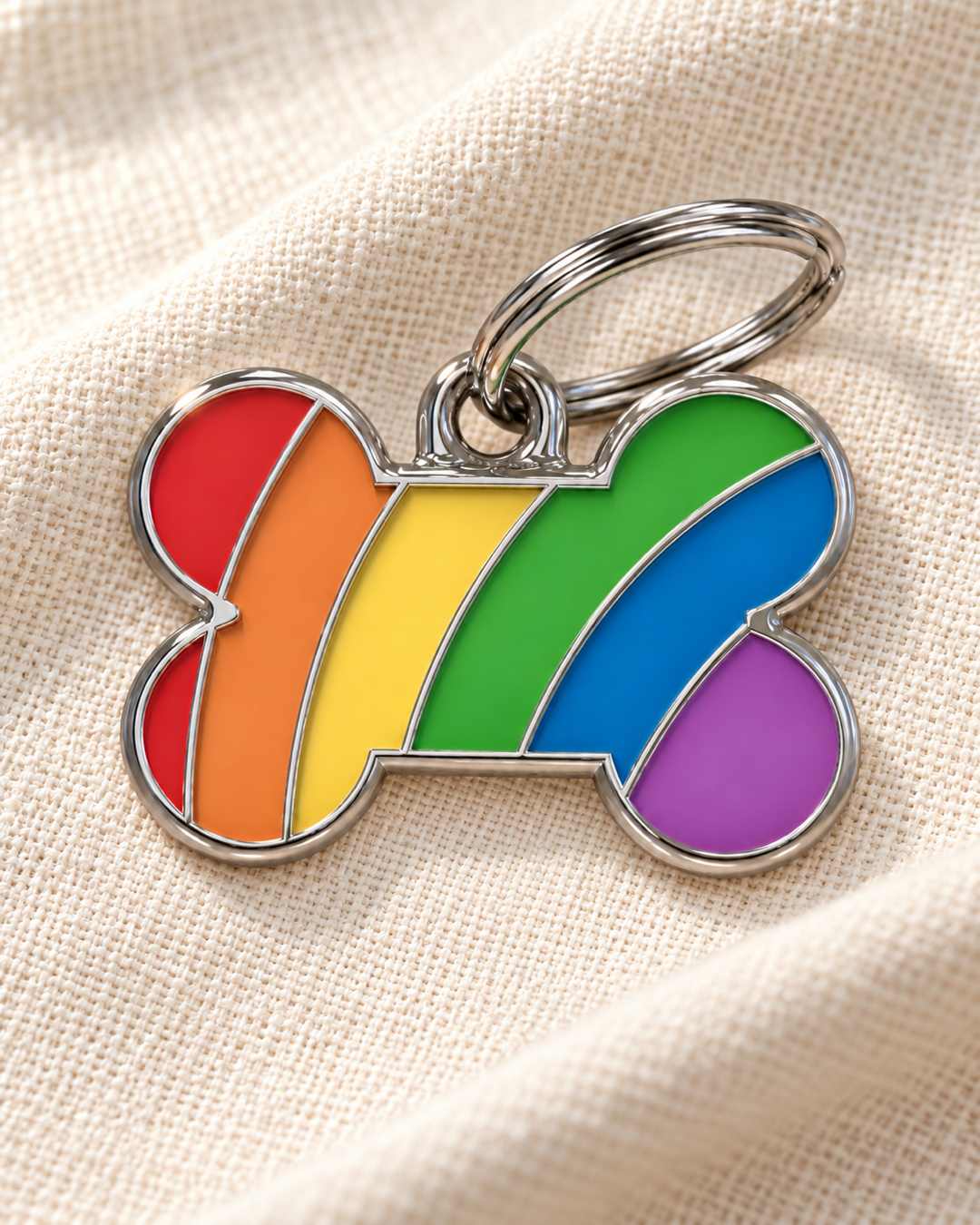 TAGiDOG Pride Bone ID Tag dog ID tag on light linen