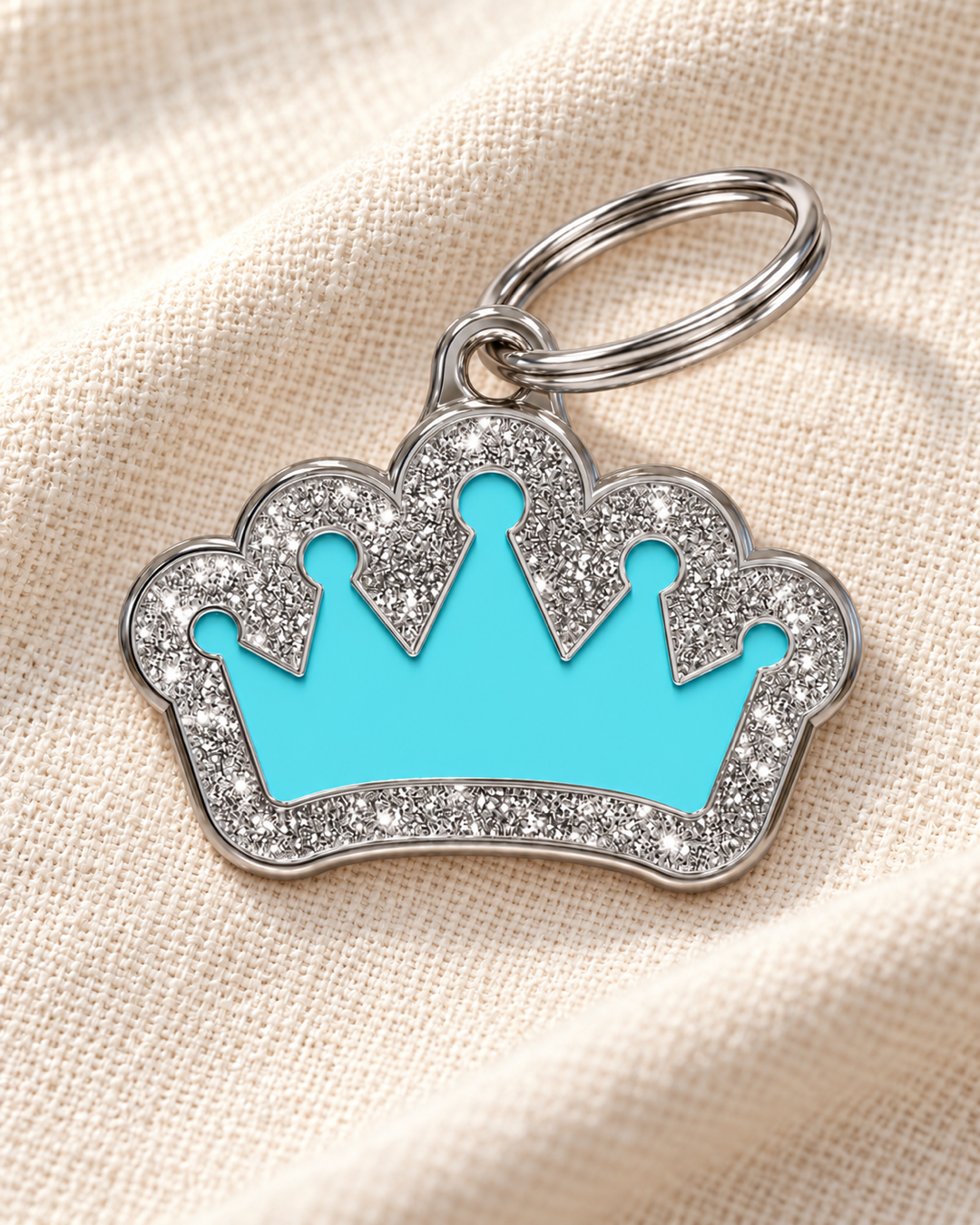 TAGiDOG Queen Spark Blue ID Tag on light linen