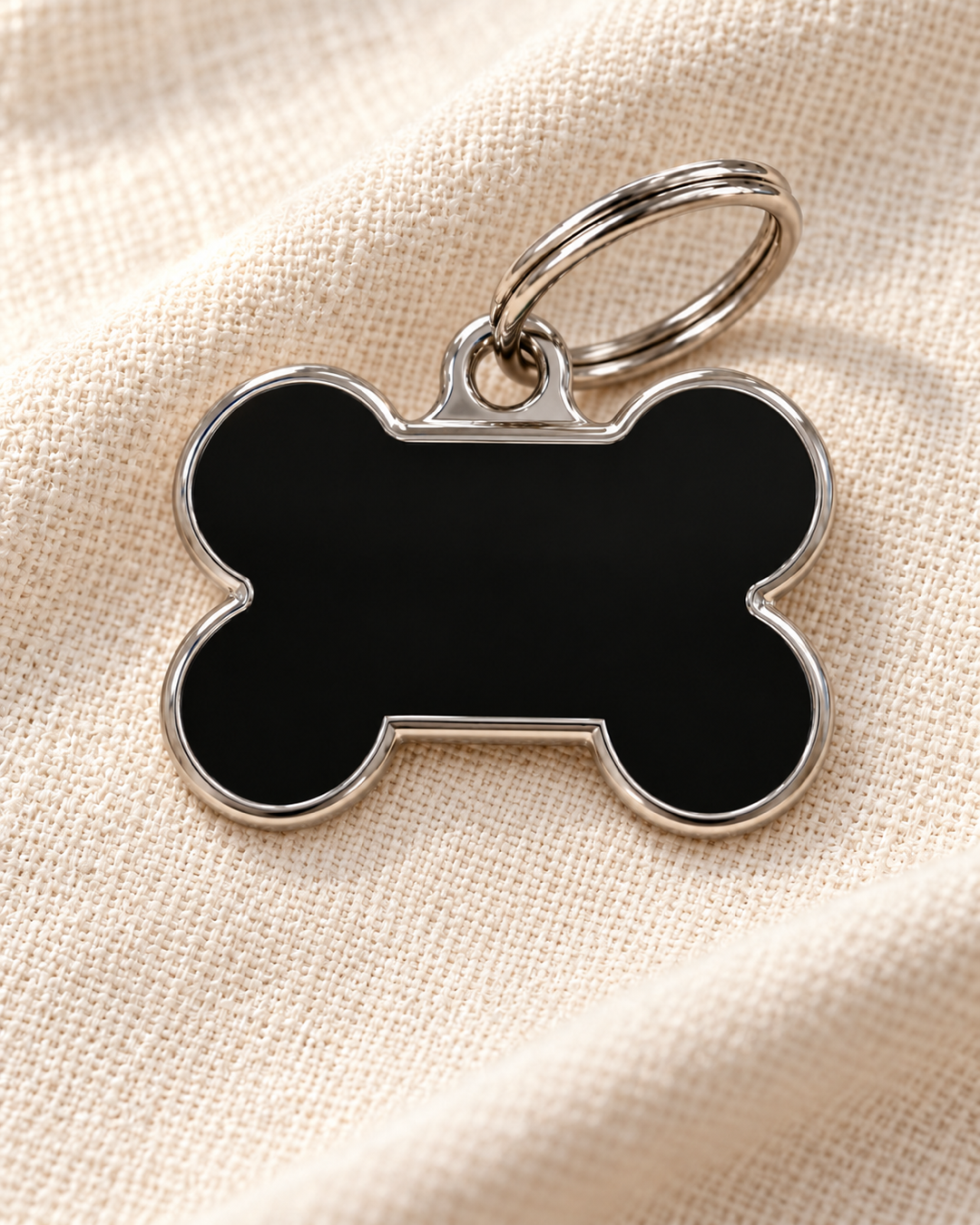 TAGiDOG Solid Bone Black ID Tag Medium dog ID tag on light linen