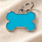 TAGiDOG Solid Bone Blue ID Tag Medium dog ID tag on light linen
