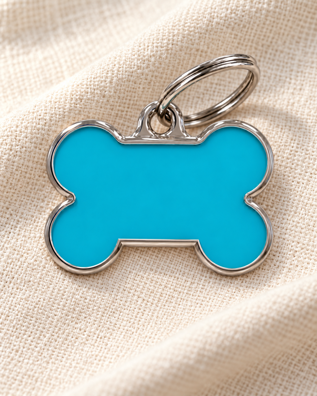 TAGiDOG Solid Bone Blue ID Tag Medium dog ID tag on light linen