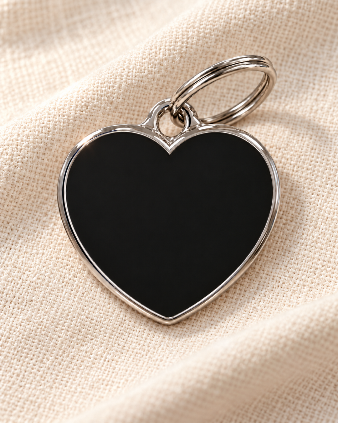 TAGiDOG Solid Heart Black ID Tag dog ID tag on light linen