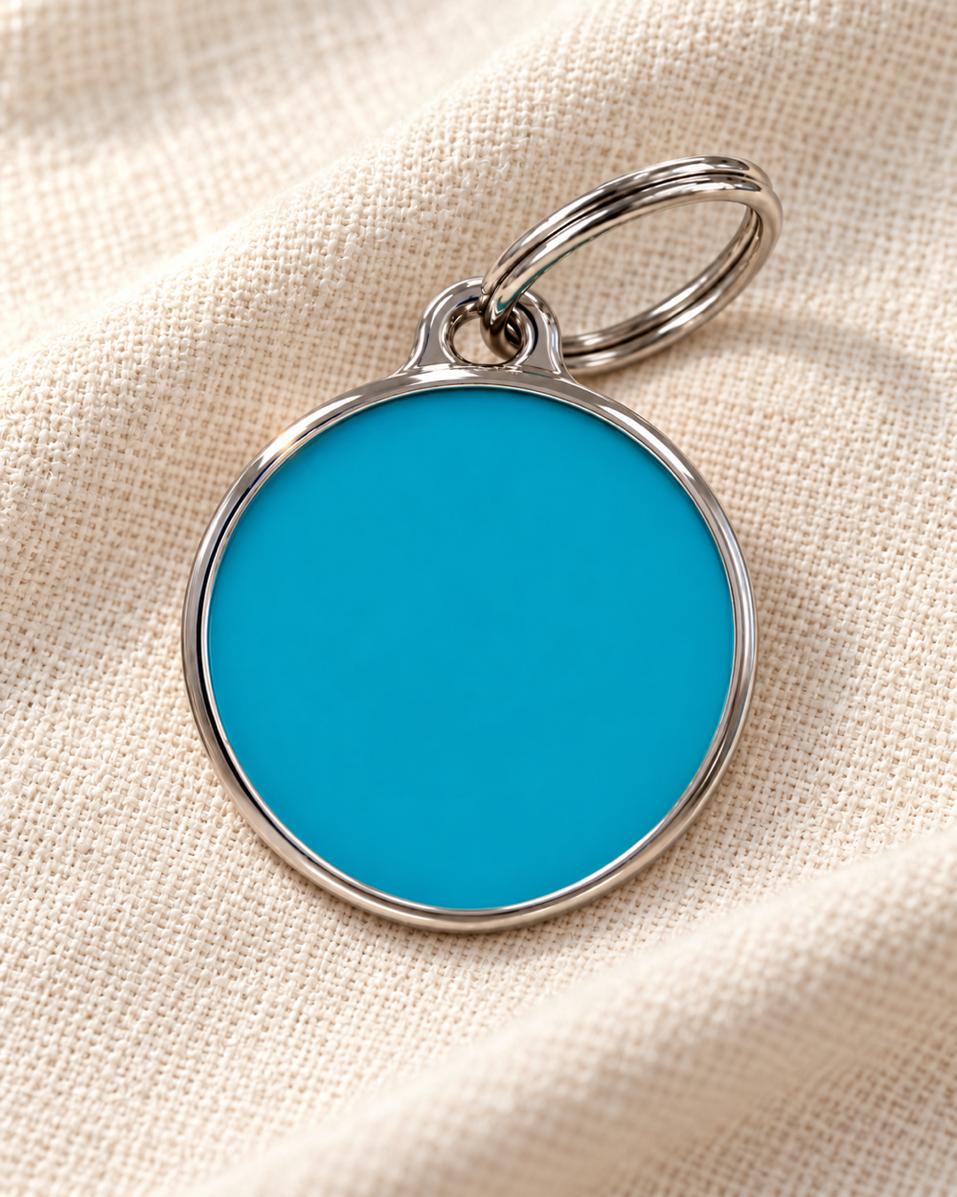 TAGiDOG Solid Round Blue ID Tag dog ID tag on light linen
